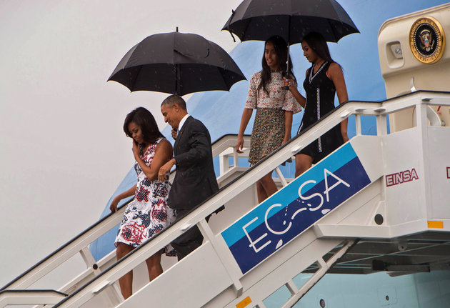 US President Barack Obama (2nd L), First Lady Michelle Obama (L) and daughters Malia (2nd R) and Sasha (R) disembark from Air Force One at the Jose Marti International Airport in Havana on March 20, 2016. Obama arrived in Cuba to bury the hatchet in a more than half-century-long Cold War conflict that turned the communist island and its giant neighbor into bitter enemies. AFP PHOTO/Nicholas KAMM / AFP / NICHOLAS KAMM (Photo credit should read NICHOLAS KAMM/AFP/Getty Images)